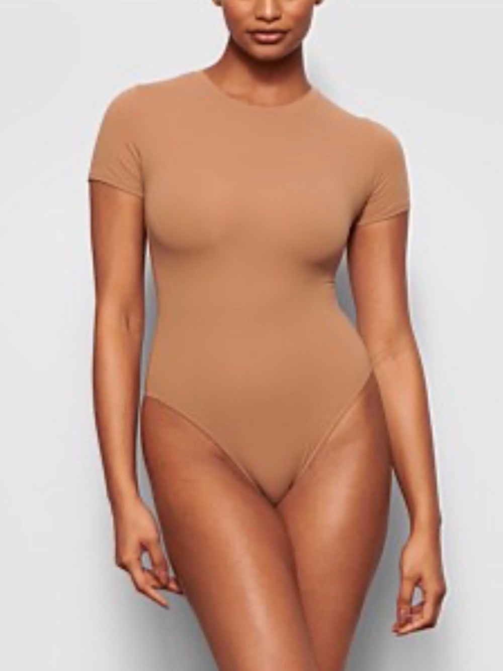 SKIMS Short Sleeve One-Piece Bodysuit in Tan